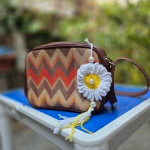 Handmade white daisy crochet bag charm with pearl tassels